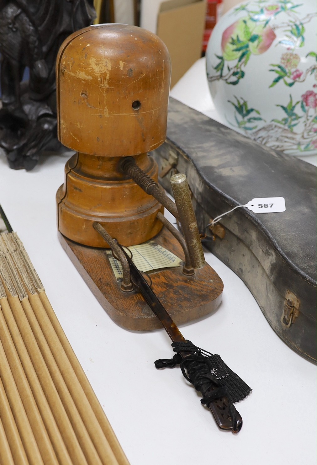 A milliner's hat stretcher and lorgnette